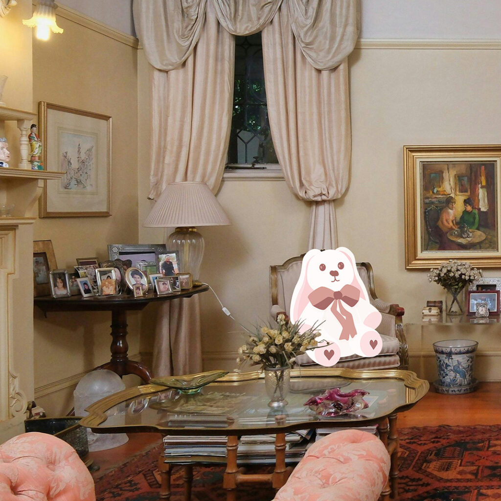 A cartoon rabbit sits in a chair inside of a fully furnished living room.