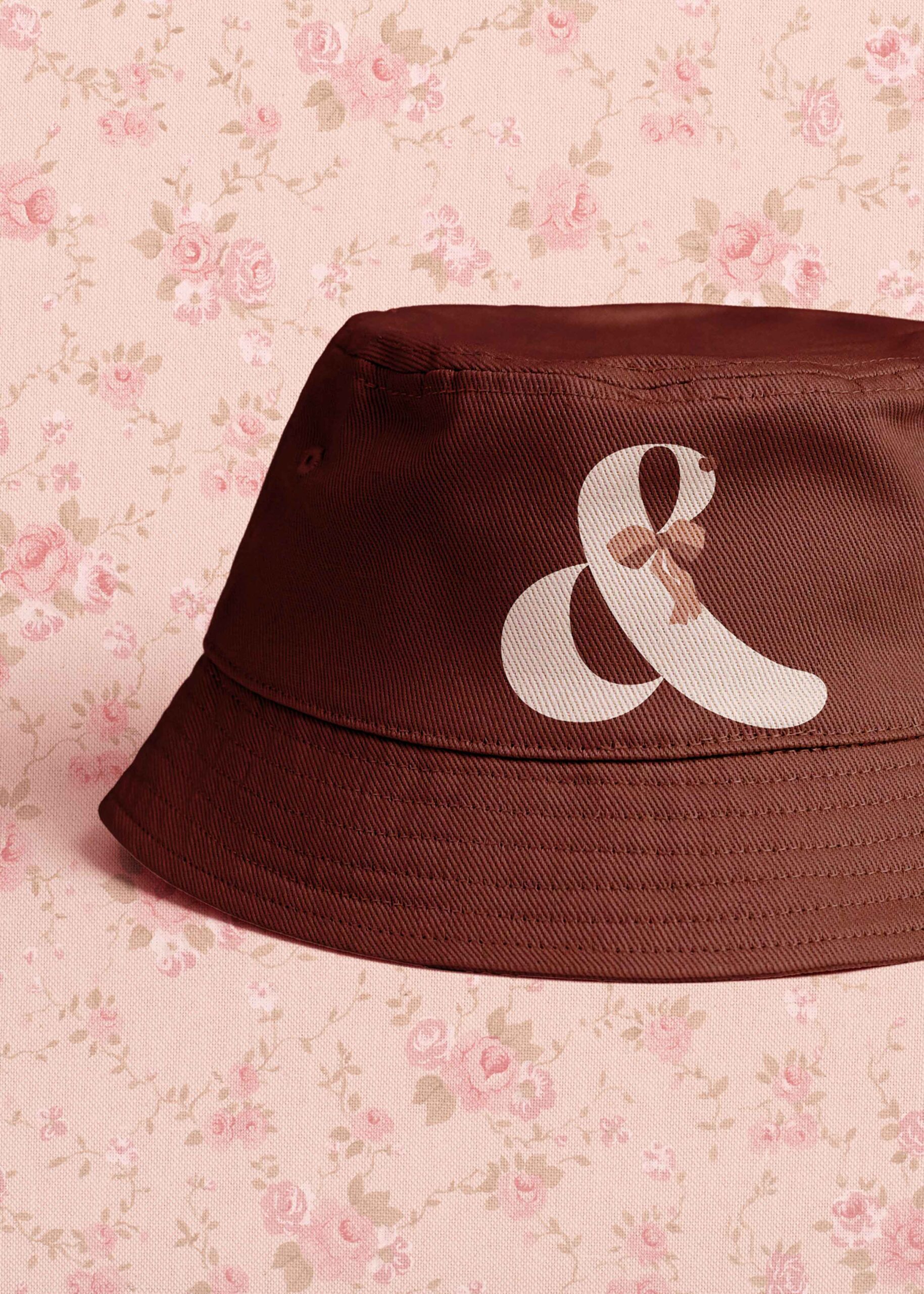 Red bucket hat with Hide and Shriek logo on the front.